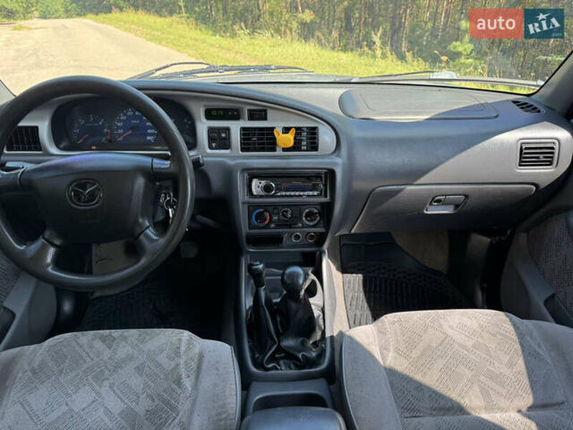 Белый Мазда Трибьют, объемом двигателя 2.5 л и пробегом 387 тыс. км за 4750 $, фото 13 на Automoto.ua