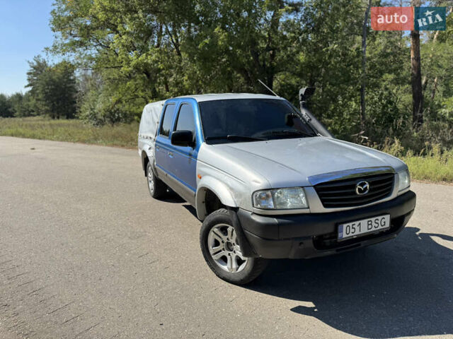 Белый Мазда Трибьют, объемом двигателя 2.5 л и пробегом 387 тыс. км за 4750 $, фото 1 на Automoto.ua