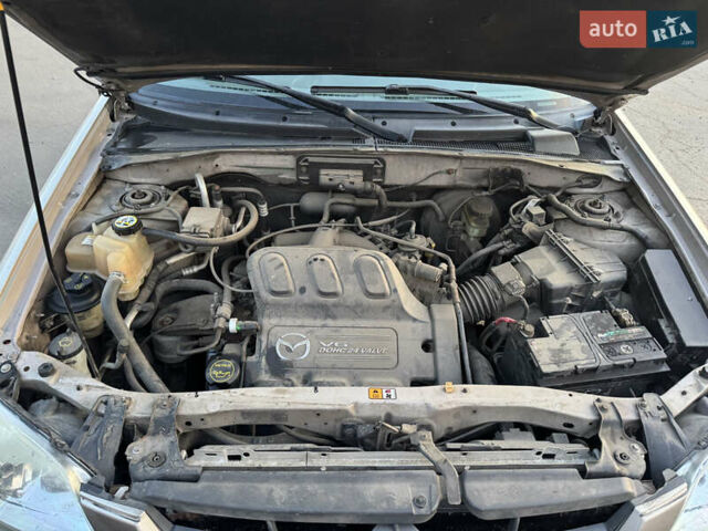 Бежевый Мазда Трибьют, объемом двигателя 3 л и пробегом 222 тыс. км за 4000 $, фото 5 на Automoto.ua