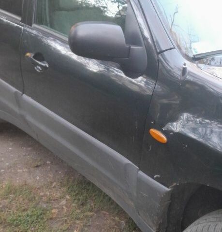 Чорний Мазда Трибьют, об'ємом двигуна 2 л та пробігом 300 тис. км за 1800 $, фото 2 на Automoto.ua