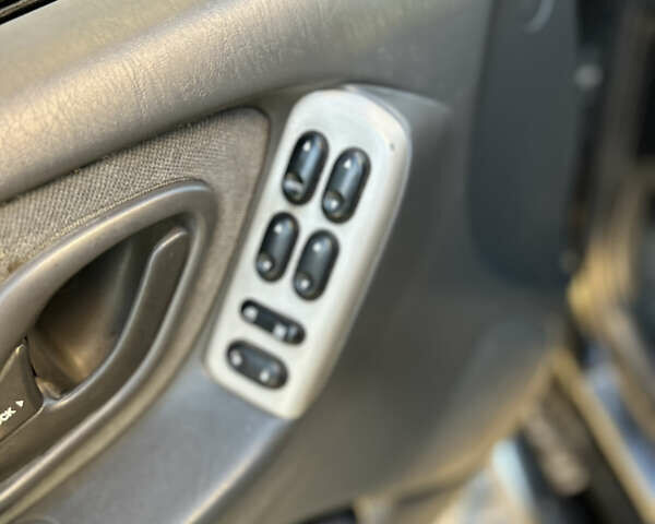 Черный Мазда Трибьют, объемом двигателя 2 л и пробегом 267 тыс. км за 4999 $, фото 24 на Automoto.ua