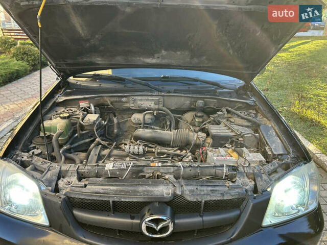 Черный Мазда Трибьют, объемом двигателя 2 л и пробегом 267 тыс. км за 4999 $, фото 39 на Automoto.ua