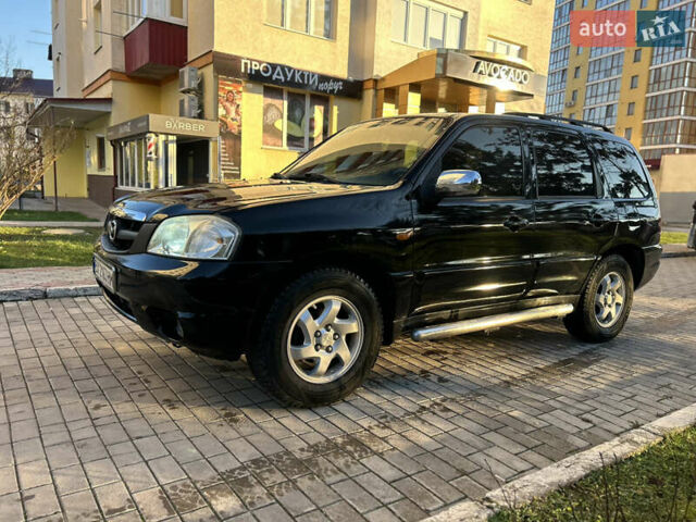 Черный Мазда Трибьют, объемом двигателя 2 л и пробегом 267 тыс. км за 4999 $, фото 4 на Automoto.ua
