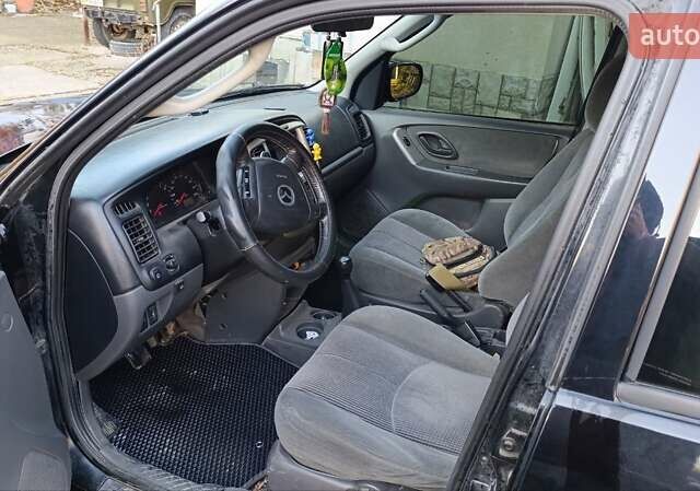 Чорний Мазда Трибьют, об'ємом двигуна 2 л та пробігом 267 тис. км за 4800 $, фото 2 на Automoto.ua