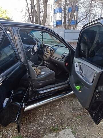 Чорний Мазда Трибьют, об'ємом двигуна 2 л та пробігом 267 тис. км за 4800 $, фото 13 на Automoto.ua