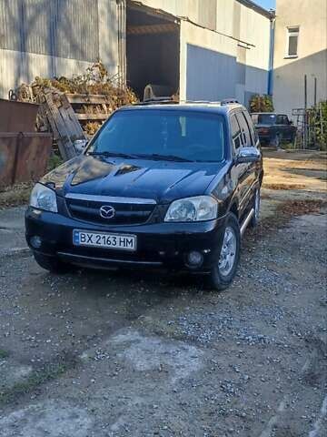 Чорний Мазда Трибьют, об'ємом двигуна 2 л та пробігом 267 тис. км за 4800 $, фото 10 на Automoto.ua