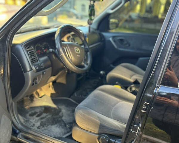 Черный Мазда Трибьют, объемом двигателя 2 л и пробегом 267 тыс. км за 4999 $, фото 27 на Automoto.ua