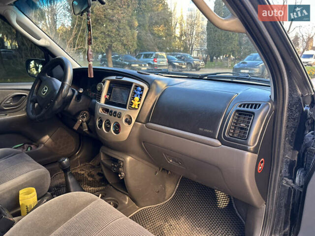 Черный Мазда Трибьют, объемом двигателя 2 л и пробегом 267 тыс. км за 4999 $, фото 37 на Automoto.ua