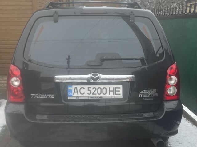 Черный Мазда Трибьют, объемом двигателя 2.3 л и пробегом 187 тыс. км за 4500 $, фото 1 на Automoto.ua