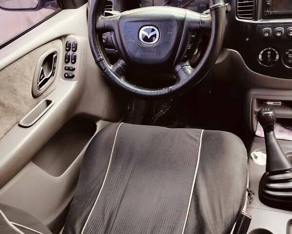 Сірий Мазда Трибьют, об'ємом двигуна 2 л та пробігом 301 тис. км за 5200 $, фото 15 на Automoto.ua