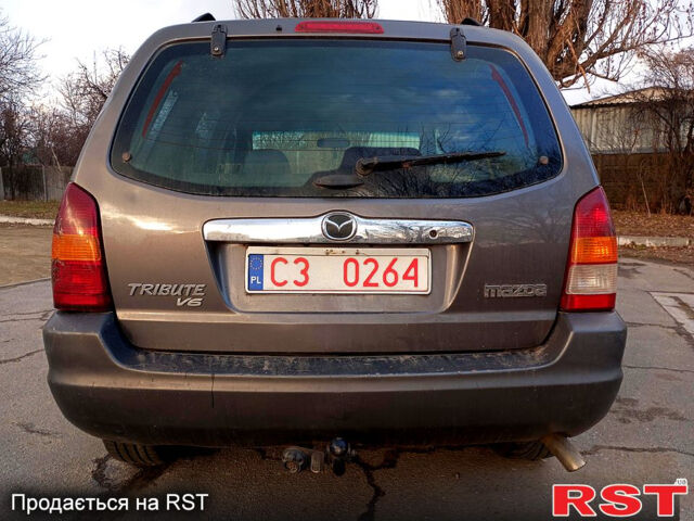 Серый Мазда Трибьют, объемом двигателя 3 л и пробегом 262 тыс. км за 3200 $, фото 9 на Automoto.ua