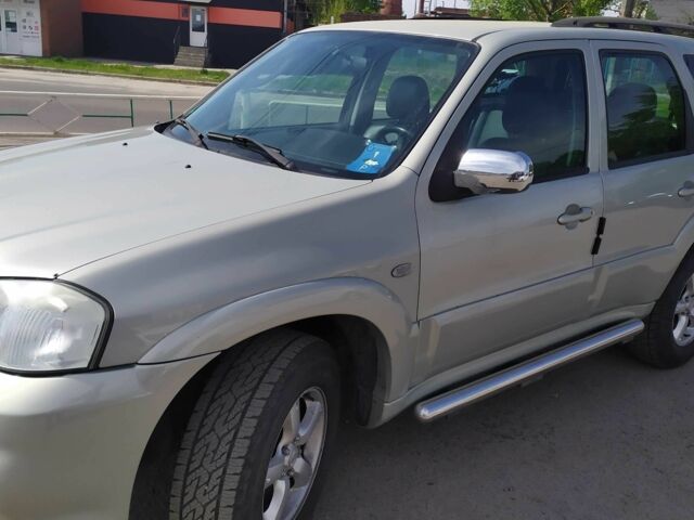 Серый Мазда Трибьют, объемом двигателя 3 л и пробегом 158 тыс. км за 5700 $, фото 1 на Automoto.ua