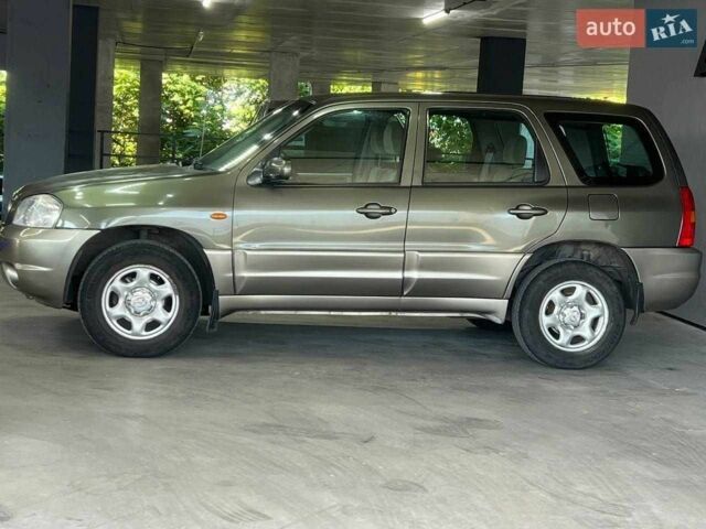 Зелений Мазда Трибьют, об'ємом двигуна 2 л та пробігом 358 тис. км за 3800 $, фото 2 на Automoto.ua