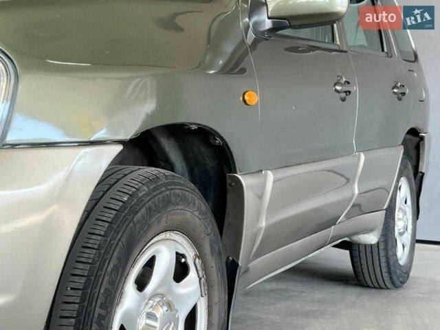 Зелений Мазда Трибьют, об'ємом двигуна 2 л та пробігом 358 тис. км за 3800 $, фото 5 на Automoto.ua