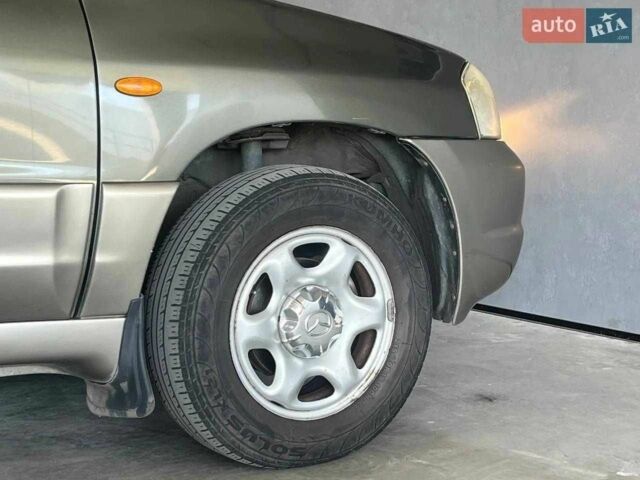 Зелений Мазда Трибьют, об'ємом двигуна 2 л та пробігом 358 тис. км за 3800 $, фото 4 на Automoto.ua