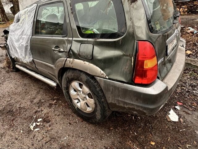 Зеленый Мазда Трибьют, объемом двигателя 3 л и пробегом 219 тыс. км за 2000 $, фото 1 на Automoto.ua