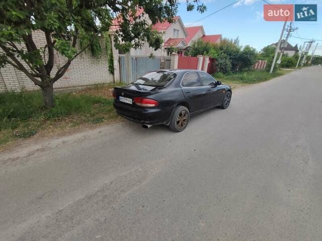 Черный Мазда Кседос 6, объемом двигателя 2 л и пробегом 420 тыс. км за 2100 $, фото 3 на Automoto.ua