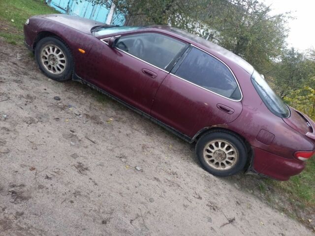 Красный Мазда Кседос 6, объемом двигателя 2 л и пробегом 300 тыс. км за 900 $, фото 5 на Automoto.ua