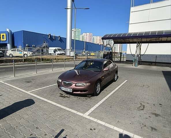 Красный Мазда Кседос 6, объемом двигателя 2 л и пробегом 396 тыс. км за 2000 $, фото 6 на Automoto.ua