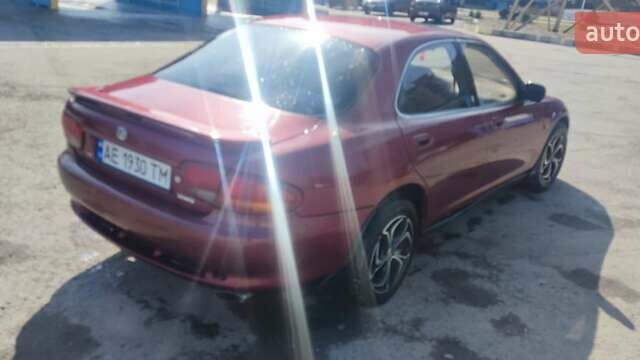 Червоний Мазда Кседос 6, об'ємом двигуна 2 л та пробігом 422 тис. км за 2300 $, фото 1 на Automoto.ua