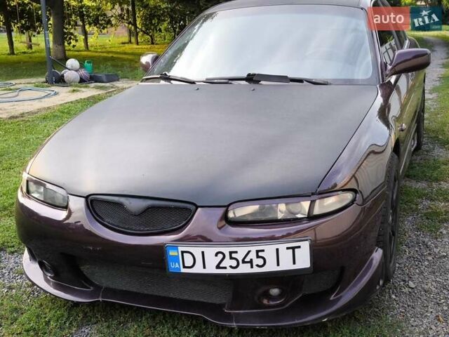 Червоний Мазда Кседос 6, об'ємом двигуна 2 л та пробігом 394 тис. км за 2999 $, фото 1 на Automoto.ua