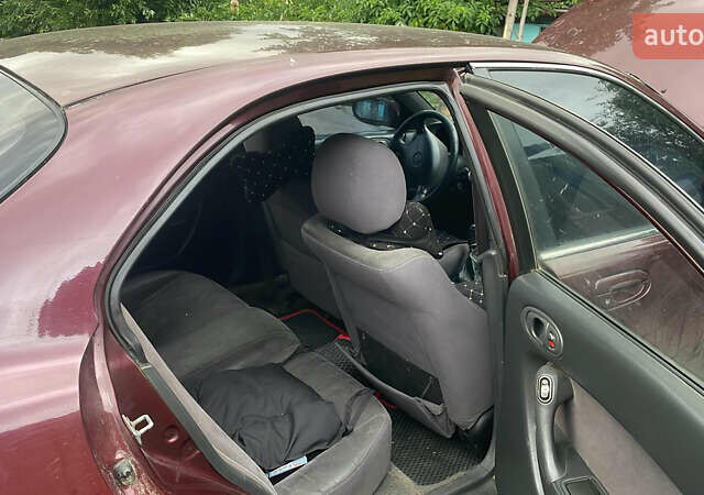 Красный Мазда Кседос 6, объемом двигателя 2 л и пробегом 2 тыс. км за 1800 $, фото 2 на Automoto.ua