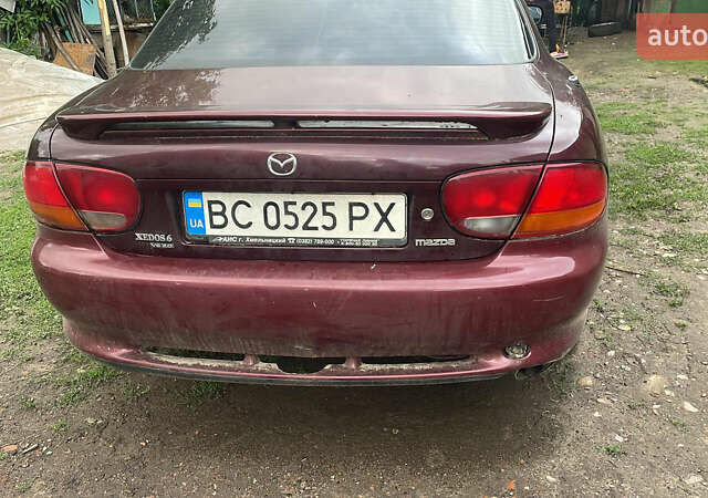 Красный Мазда Кседос 6, объемом двигателя 2 л и пробегом 2 тыс. км за 1800 $, фото 1 на Automoto.ua