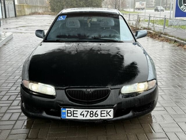 Серый Мазда Кседос 6, объемом двигателя 2 л и пробегом 250 тыс. км за 999 $, фото 1 на Automoto.ua