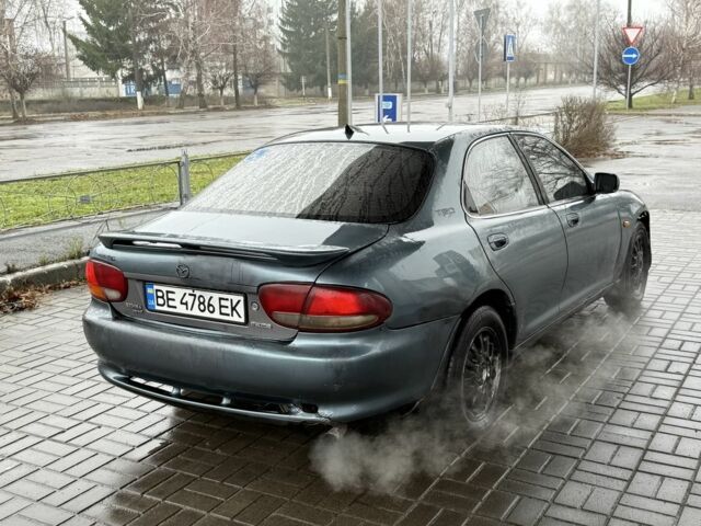 Серый Мазда Кседос 6, объемом двигателя 2 л и пробегом 250 тыс. км за 999 $, фото 3 на Automoto.ua