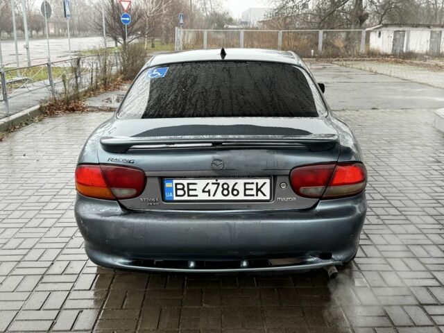 Серый Мазда Кседос 6, объемом двигателя 2 л и пробегом 250 тыс. км за 999 $, фото 4 на Automoto.ua