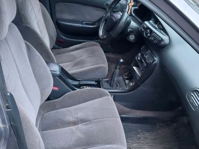 Серый Мазда Кседос 6, объемом двигателя 2 л и пробегом 358 тыс. км за 1303 $, фото 3 на Automoto.ua