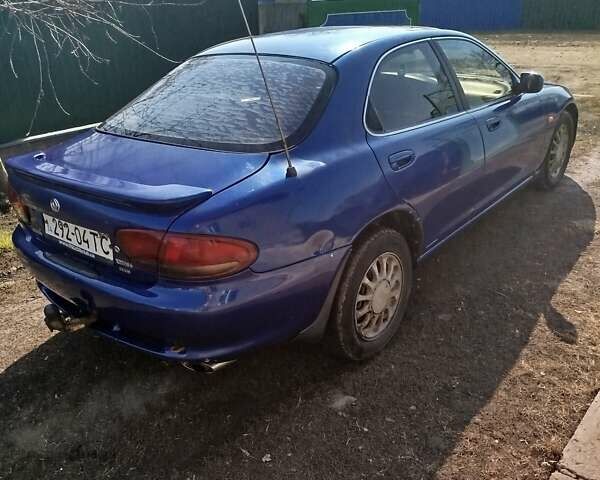 Синій Мазда Кседос 6, об'ємом двигуна 2 л та пробігом 350 тис. км за 2000 $, фото 4 на Automoto.ua