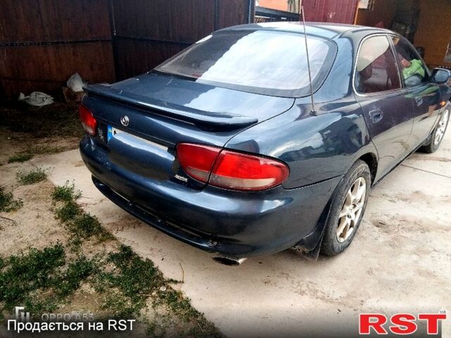 Синий Мазда Кседос 6, объемом двигателя 2 л и пробегом 305 тыс. км за 1100 $, фото 2 на Automoto.ua