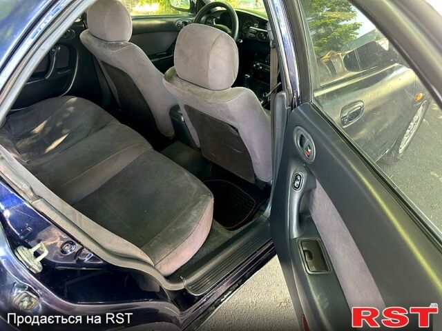 Синий Мазда Кседос 6, объемом двигателя 2 л и пробегом 320 тыс. км за 1450 $, фото 7 на Automoto.ua