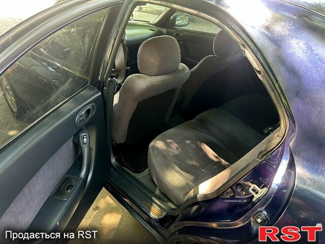 Синий Мазда Кседос 6, объемом двигателя 2 л и пробегом 320 тыс. км за 1450 $, фото 6 на Automoto.ua