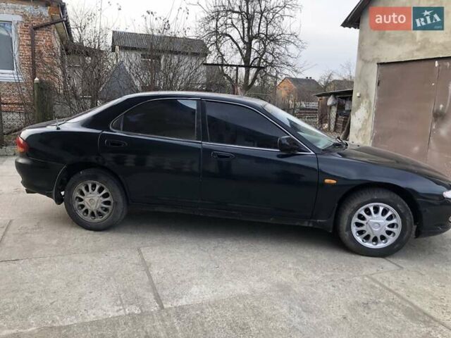 Синий Мазда Кседос 6, объемом двигателя 2 л и пробегом 300 тыс. км за 1350 $, фото 4 на Automoto.ua