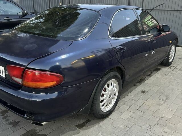 Синій Мазда Кседос 6, об'ємом двигуна 2 л та пробігом 380 тис. км за 1500 $, фото 19 на Automoto.ua