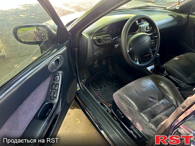 Синий Мазда Кседос 6, объемом двигателя 2 л и пробегом 320 тыс. км за 1450 $, фото 5 на Automoto.ua