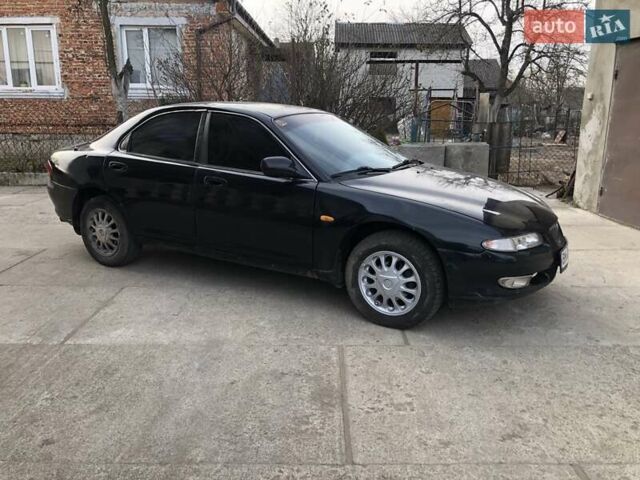 Синий Мазда Кседос 6, объемом двигателя 2 л и пробегом 300 тыс. км за 1350 $, фото 9 на Automoto.ua