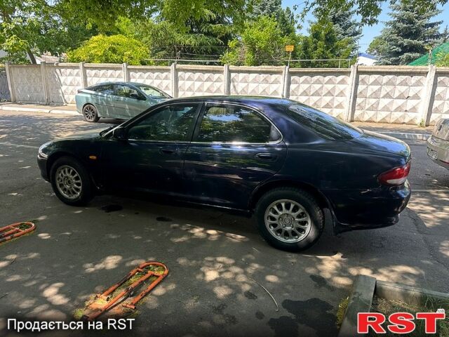 Синий Мазда Кседос 6, объемом двигателя 2 л и пробегом 320 тыс. км за 1450 $, фото 4 на Automoto.ua
