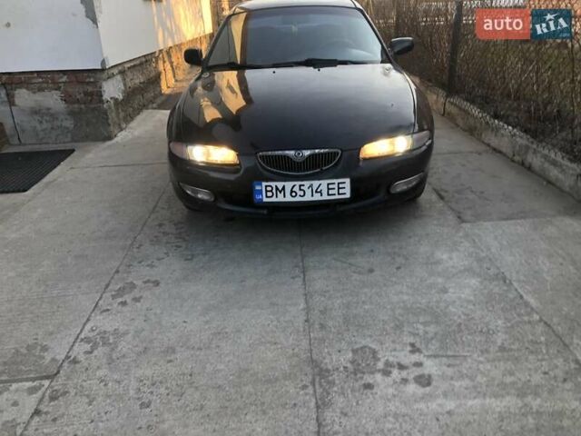 Синий Мазда Кседос 6, объемом двигателя 2 л и пробегом 300 тыс. км за 1350 $, фото 3 на Automoto.ua