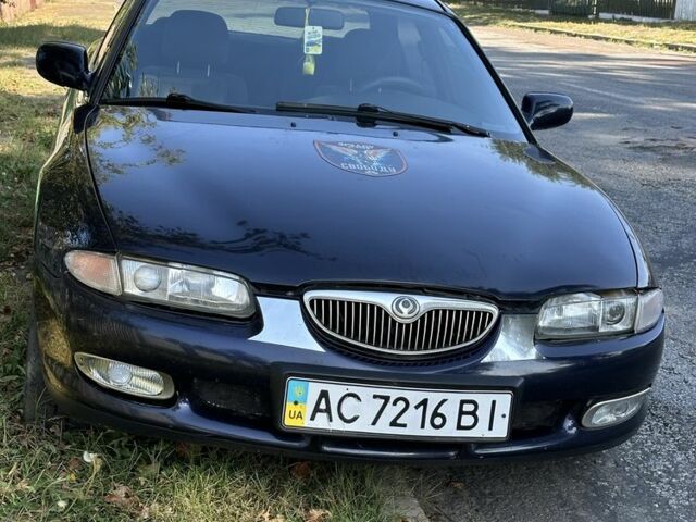 Синій Мазда Кседос 6, об'ємом двигуна 2 л та пробігом 380 тис. км за 1500 $, фото 1 на Automoto.ua