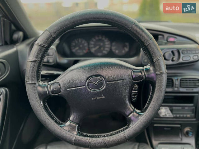 Синий Мазда Кседос 6, объемом двигателя 2 л и пробегом 300 тыс. км за 2250 $, фото 42 на Automoto.ua