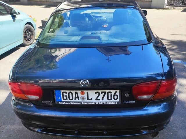 Синий Мазда Кседос 6, объемом двигателя 2 л и пробегом 1 тыс. км за 1800 $, фото 1 на Automoto.ua