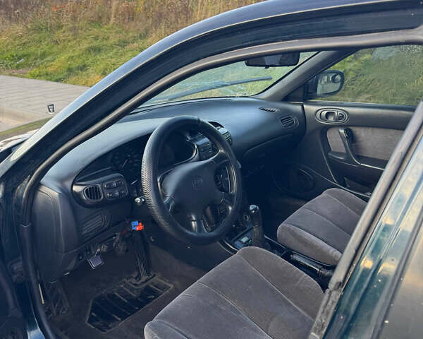 Зеленый Мазда Кседос 6, объемом двигателя 2 л и пробегом 230 тыс. км за 1350 $, фото 7 на Automoto.ua