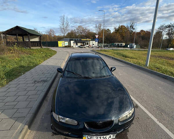 Зеленый Мазда Кседос 6, объемом двигателя 2 л и пробегом 230 тыс. км за 1350 $, фото 3 на Automoto.ua