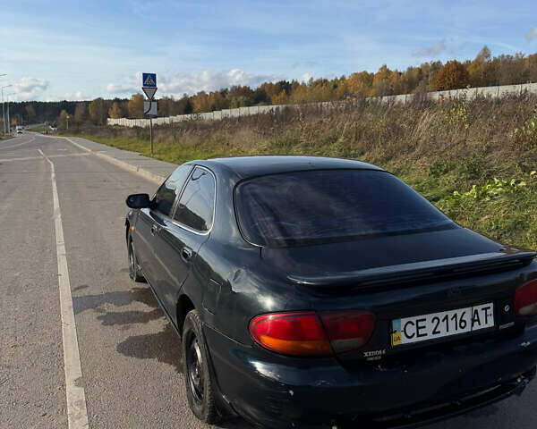 Зеленый Мазда Кседос 6, объемом двигателя 2 л и пробегом 230 тыс. км за 1350 $, фото 4 на Automoto.ua