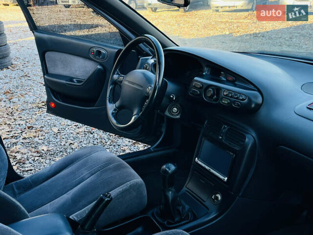 Зеленый Мазда Кседос 6, объемом двигателя 2 л и пробегом 213 тыс. км за 1900 $, фото 19 на Automoto.ua