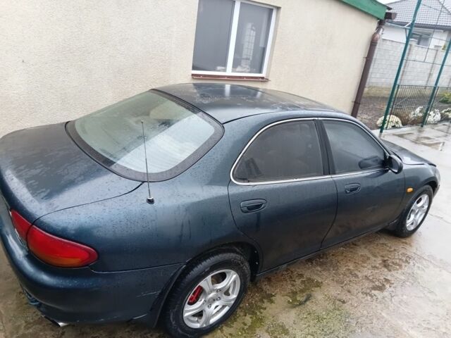 Зеленый Мазда Кседос 6, объемом двигателя 2 л и пробегом 200 тыс. км за 1300 $, фото 1 на Automoto.ua