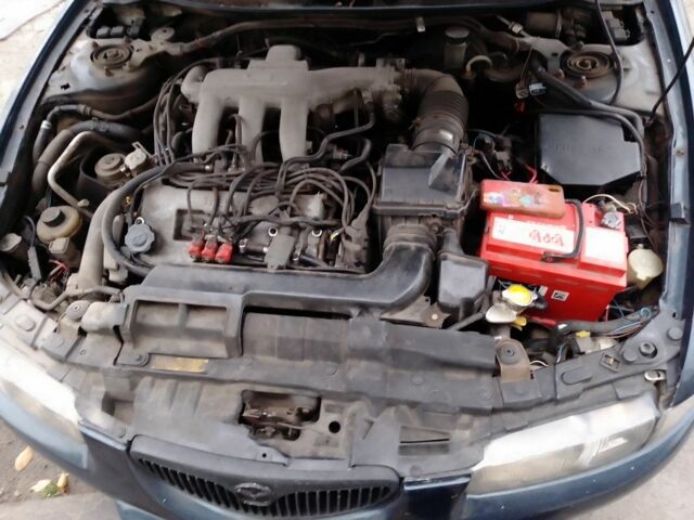 Зеленый Мазда Кседос 6, объемом двигателя 2 л и пробегом 400 тыс. км за 1500 $, фото 10 на Automoto.ua